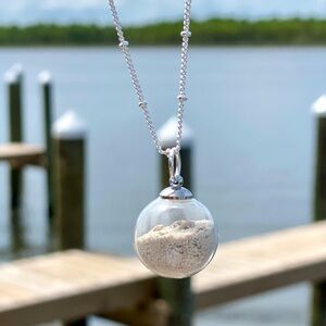 110. Glass globe necklace with Bahamas beach sand